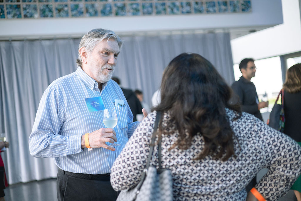 people speaking with one another during a reception