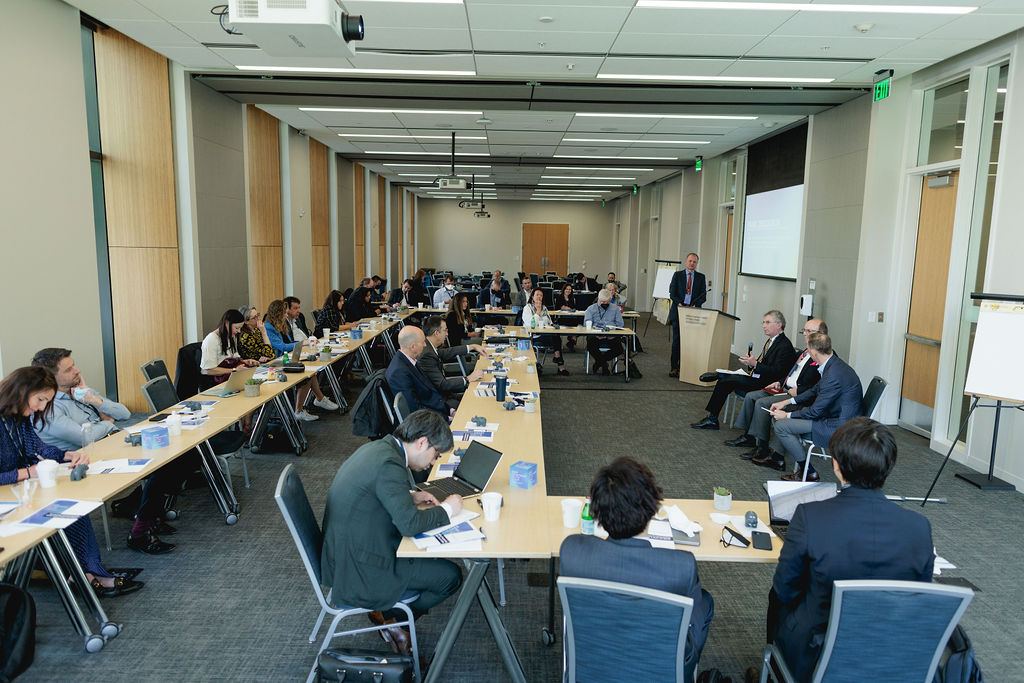 a large conference room people seated at tables
