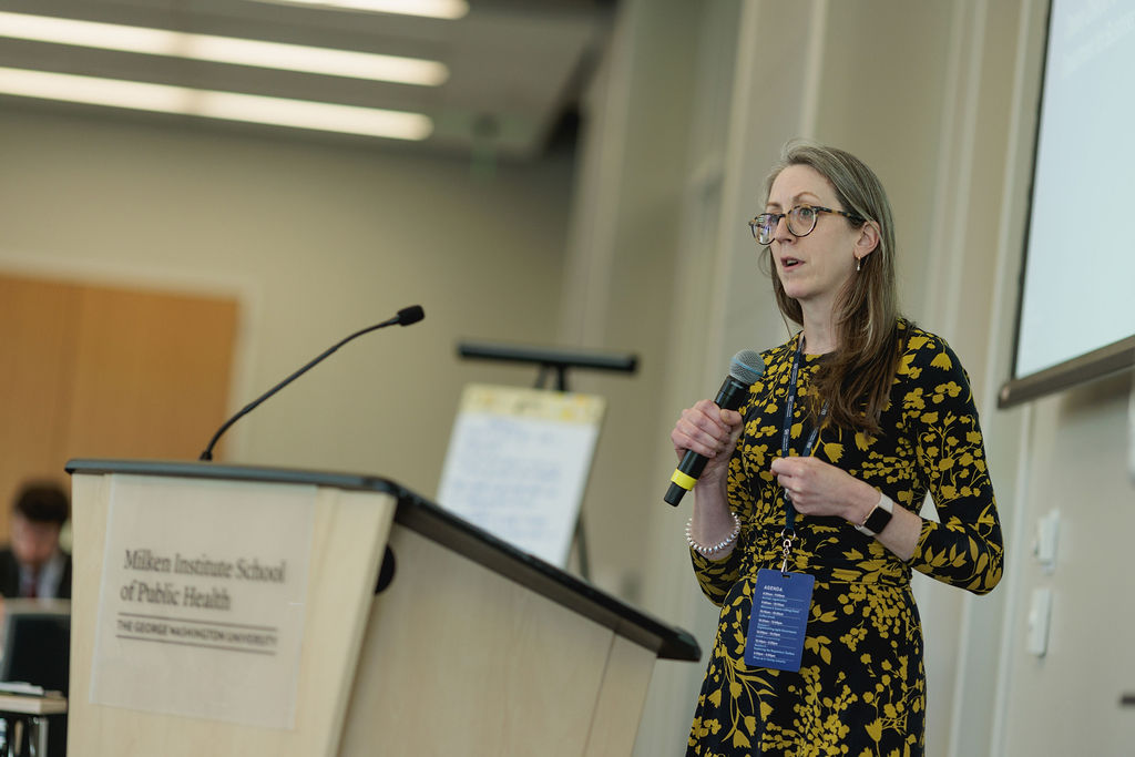 a lady speaking from a lectern