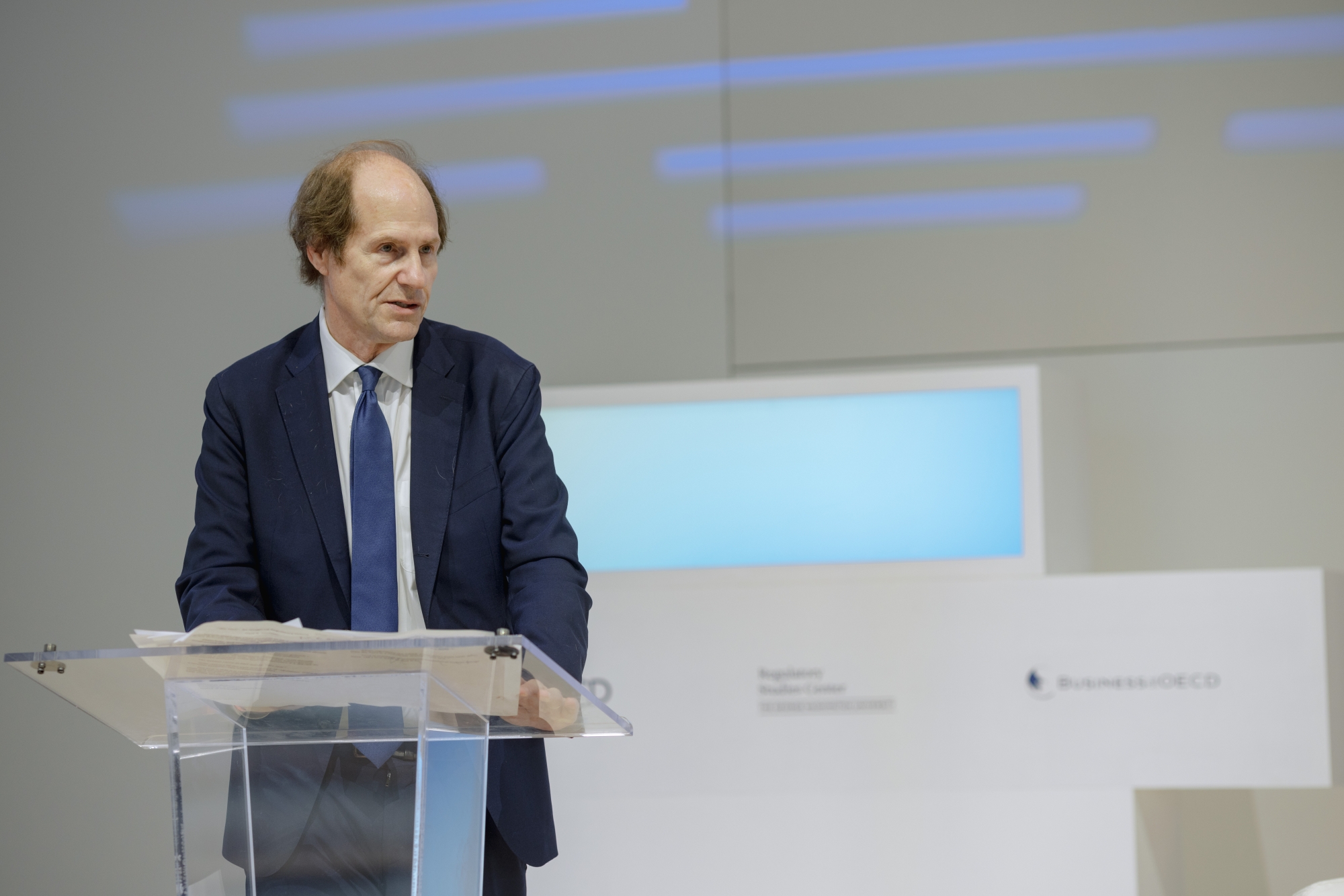 Cass Sunstein speaking at a podium