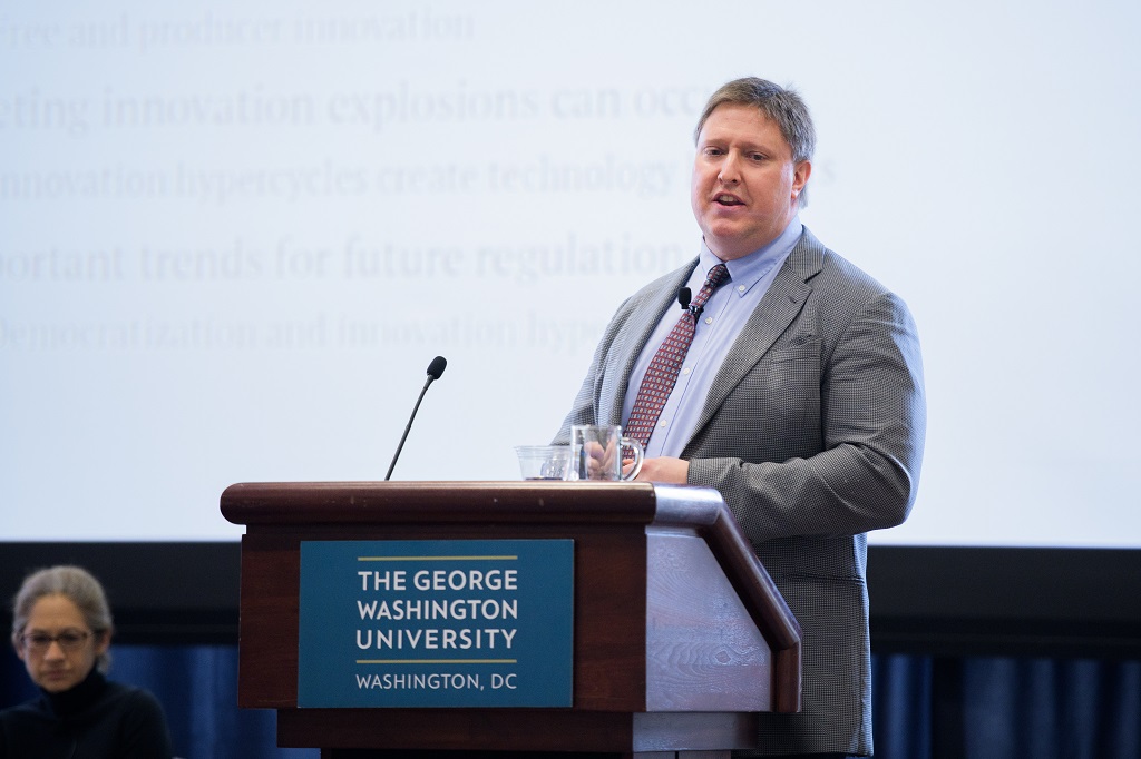 Andrew Torrance at a podium