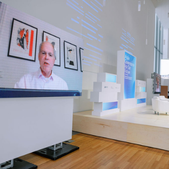 Photo of Jeffrey Schlagenhauf speaking on a video screen