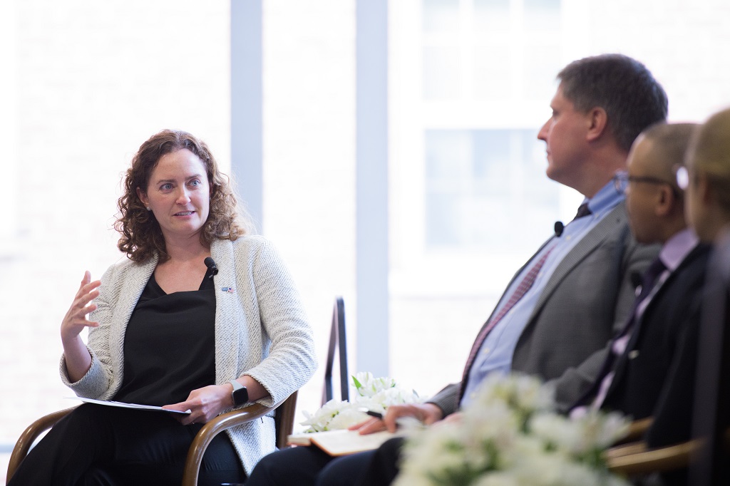 Bridget Dooling sitting down and chatting with panelists