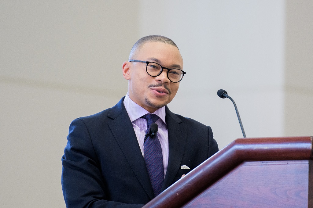 Remington Gregg at a podium