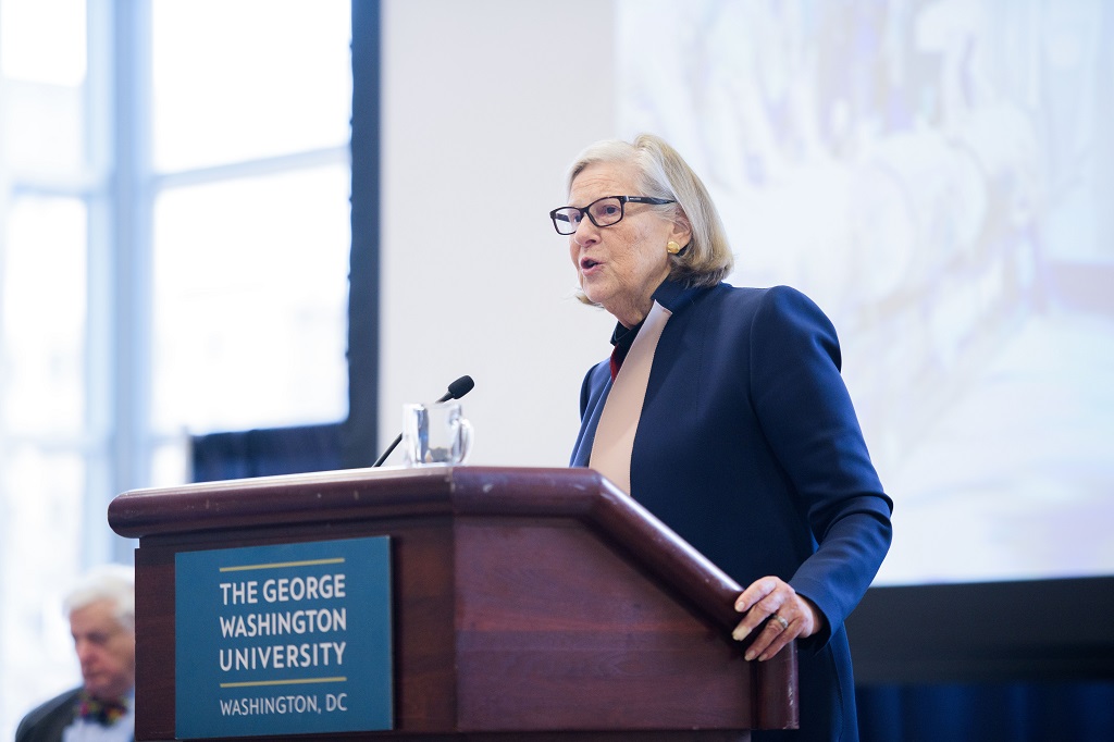Sally Katzen standing at a podium
