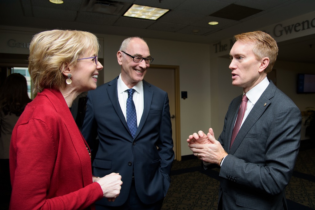 Susan Dudley, Robert Miller, and Senator James Lankford chatting