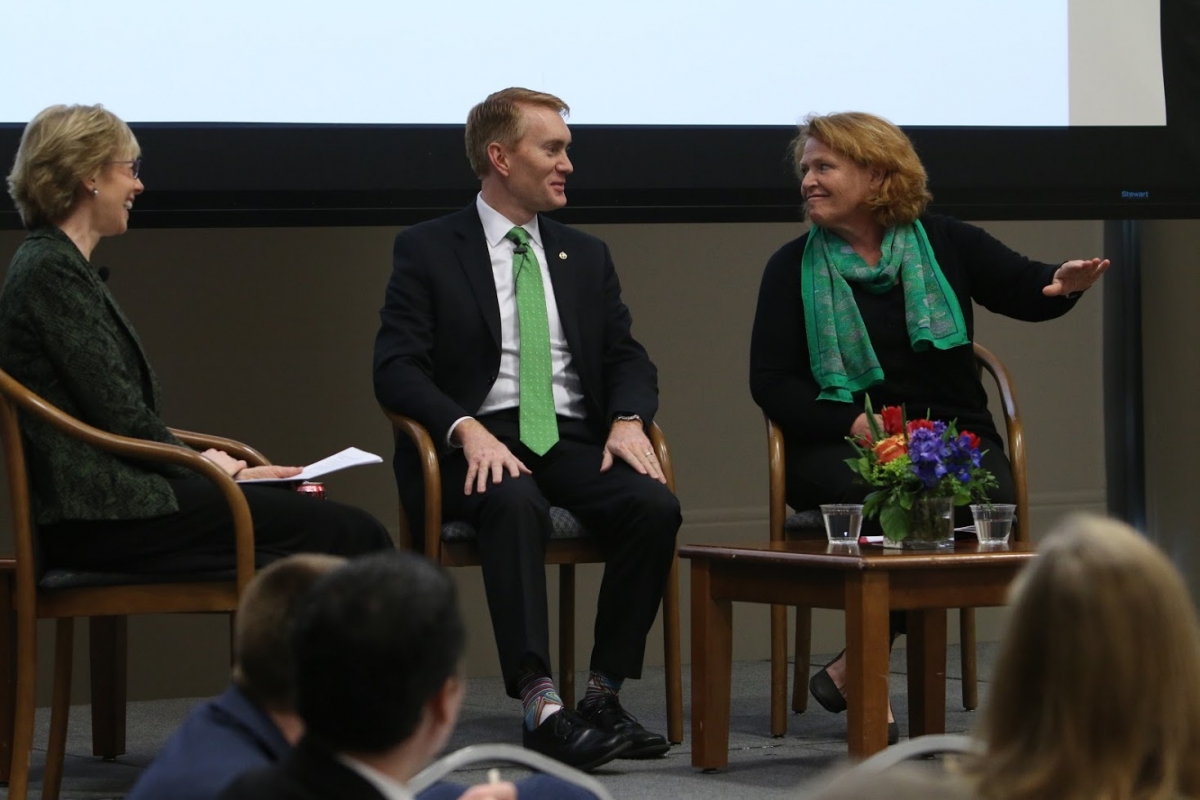 Photo of Susan Dudley, Senator James Lankford, and Senator Heidi Heitkamp seated on stage together.