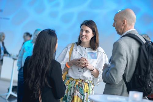 Photo of people talking during a reception.