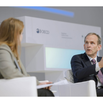 Photo of Ashley Gold and Kent Walker seated on stage