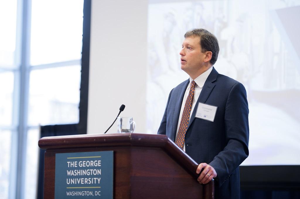 Christopher Carrigan standing at a podium