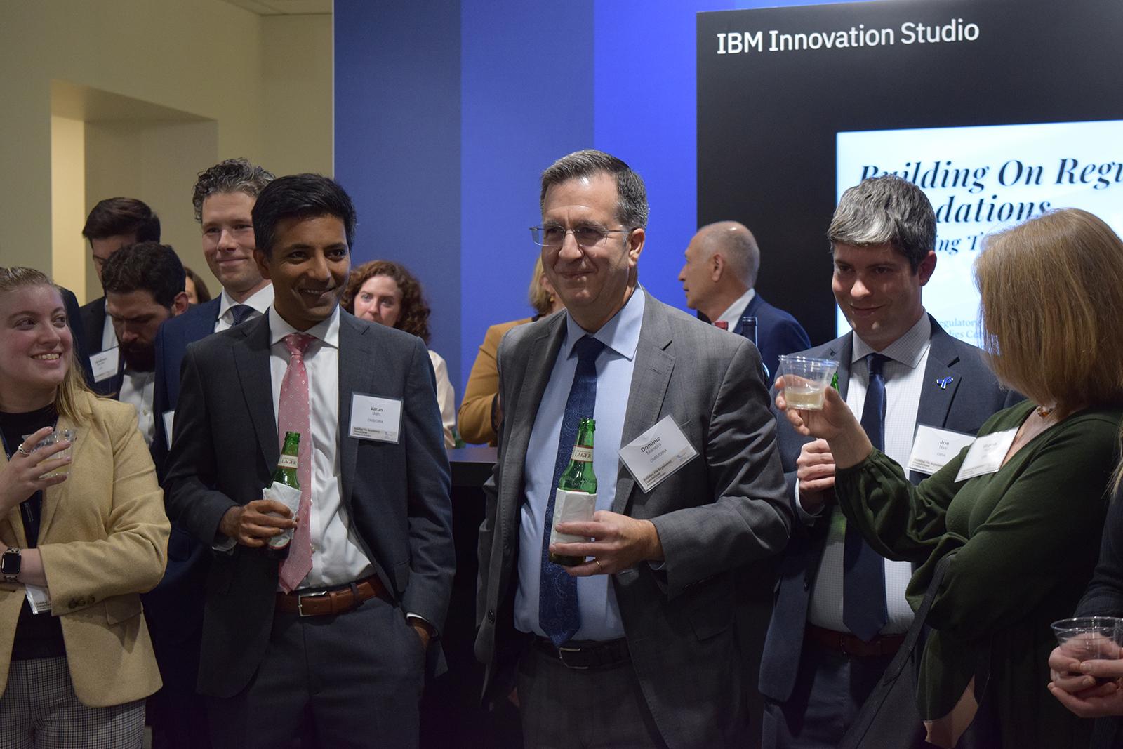 Attendees join Administrator Revesz in toasting OIRA Dep. Administrator Dominic Mancini for receiving a 2023 Presidential Rank Award